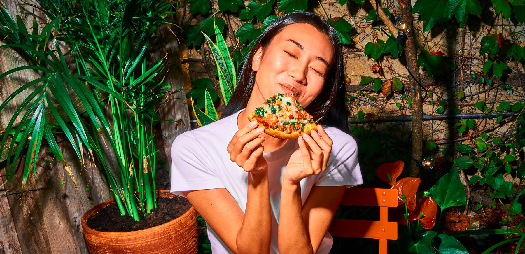 Woman enjoying Banza pizza