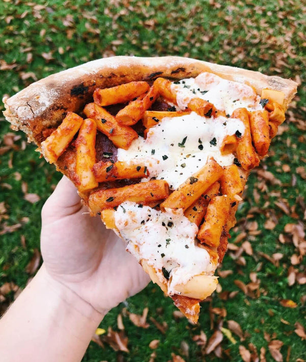 Slice of Banza Pizza with ziti