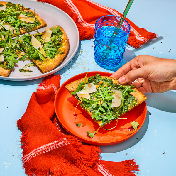 PESTO PIZZA WITH ARUGULA, BALSAMIC, AND PINE NUTS